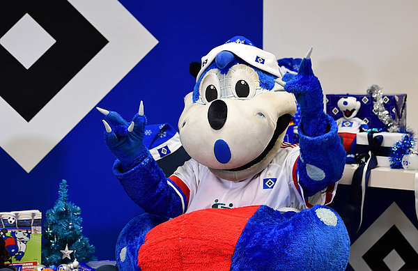 Ließ sich den Spaß nicht nehmen: Selbstverständlich war auch HSV-Maskottchen Dino Hermann bei der digitalen Lesung dabei.