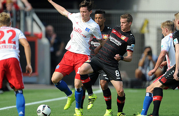 Gregoritsch battles Leverkusen’s Lars Bender.